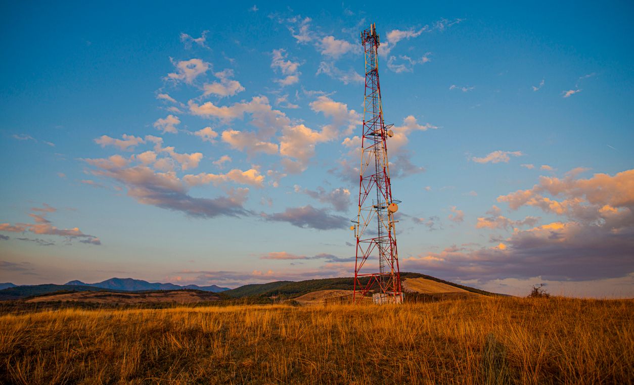 A cellular tower in a field
