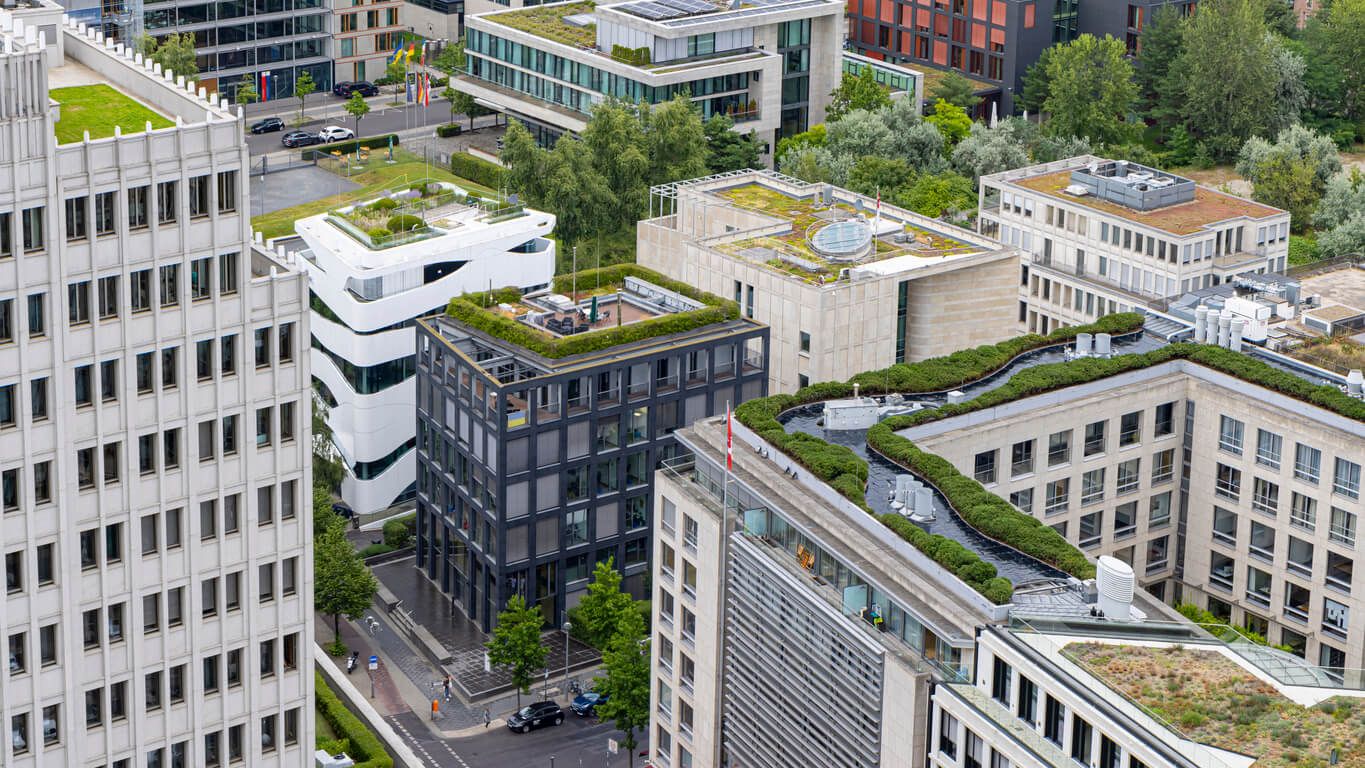 Aerial view of a smart city with green rooftops