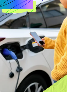 Woman in a yellow sweater charging their electric vehicle