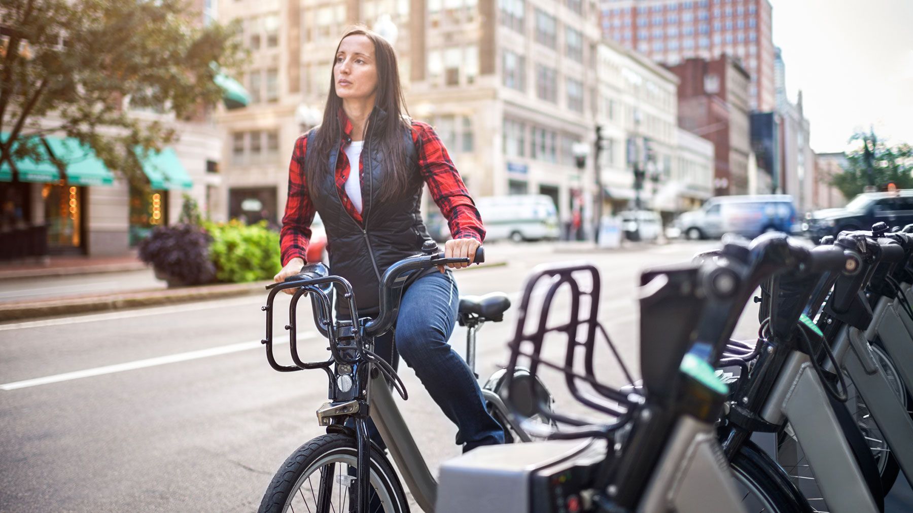 woman using bike sharing
