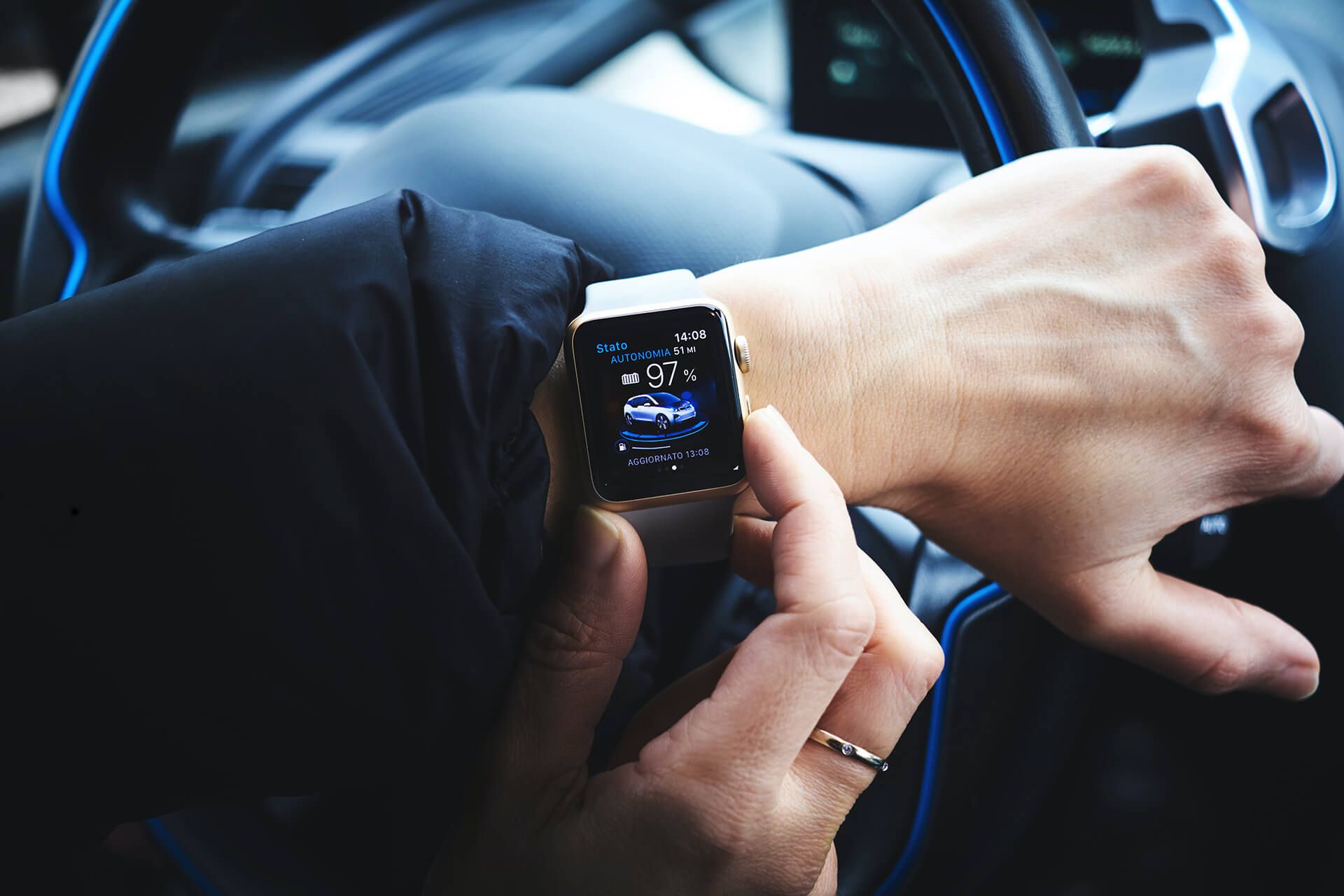 A person controls a smart car via their smart watch app