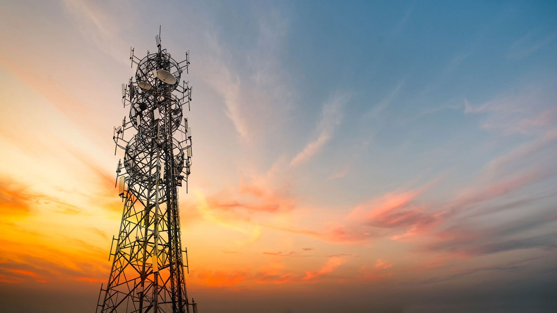 5G cellular tower at sunset