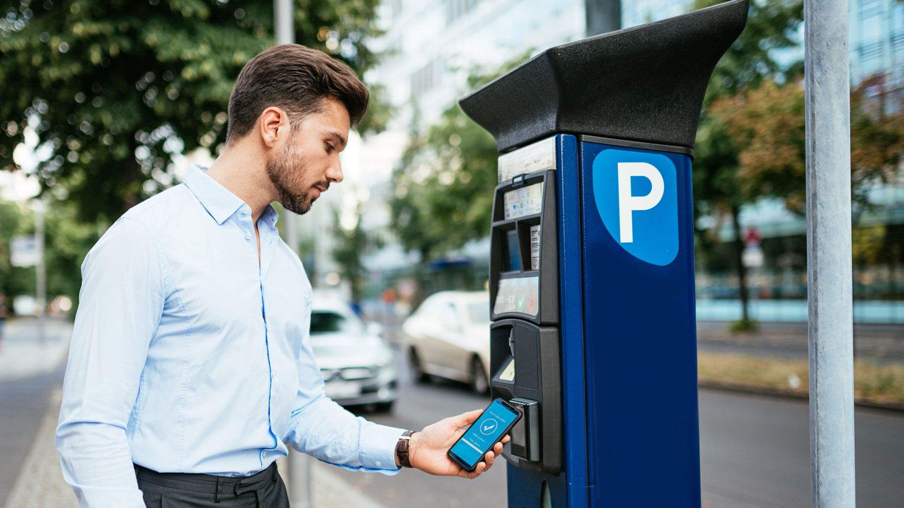 Man using smart parking meter