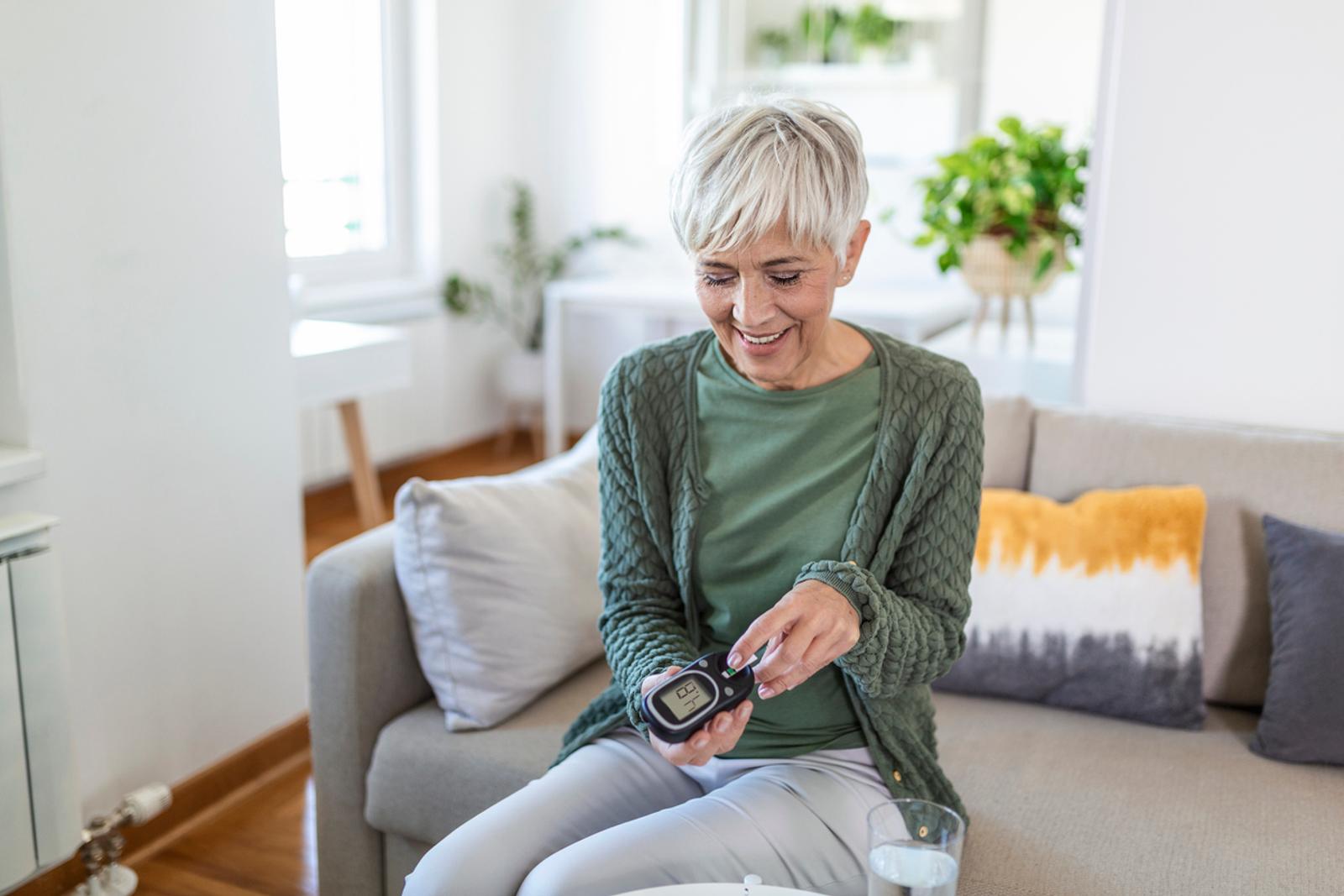 woman with diabetes remote testing device