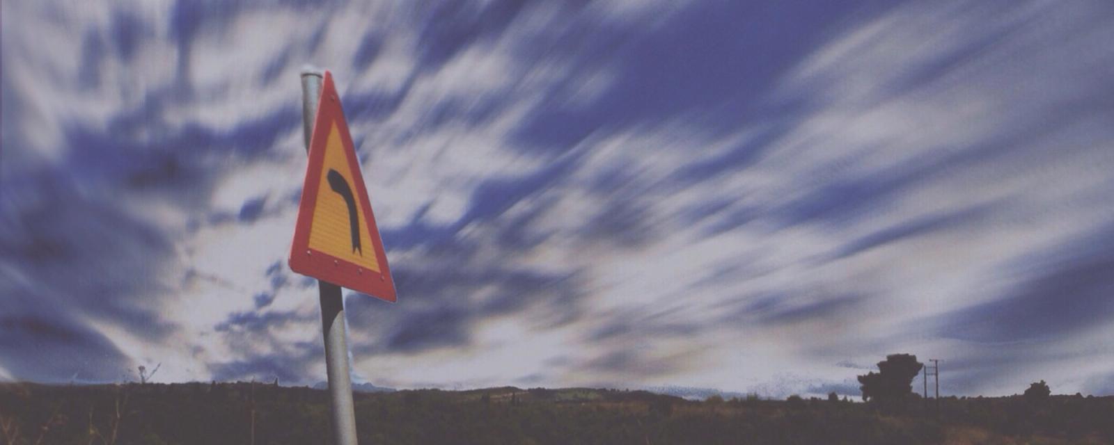 Turning road sign
