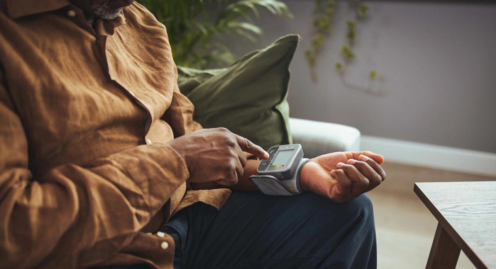Man checks blood pressure cuff