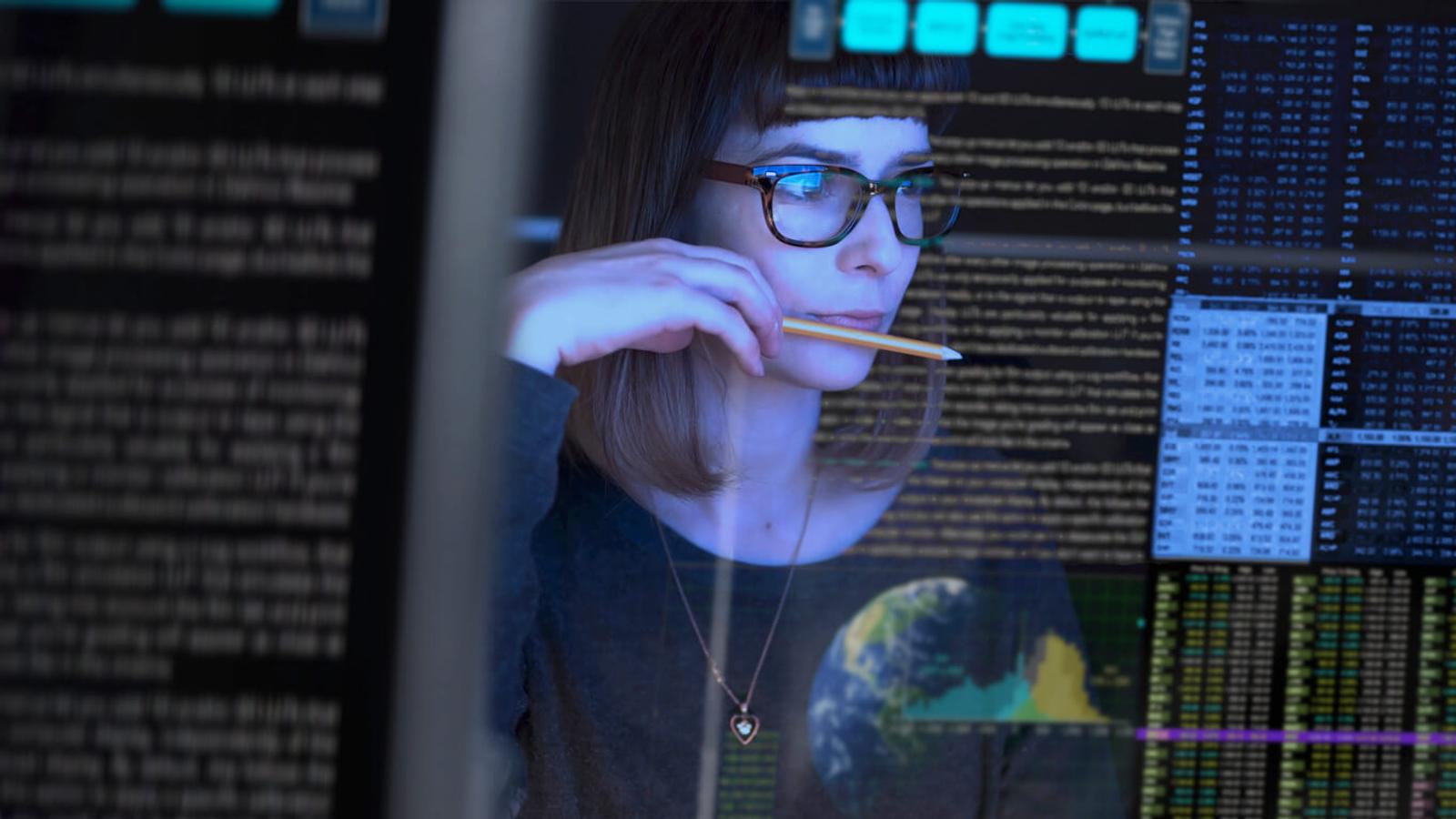 Woman looking at screen code