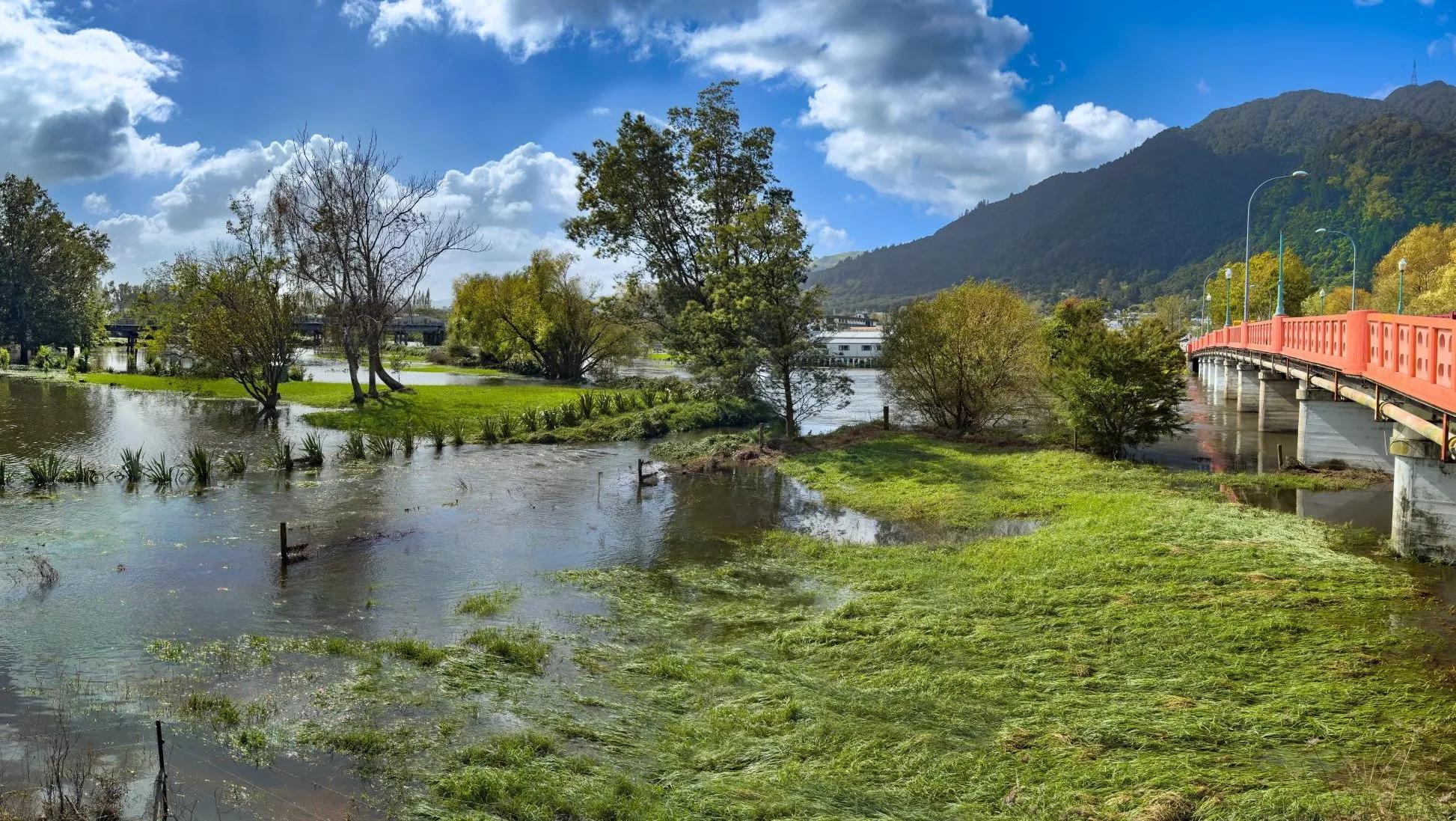 photo of flood waters over a riverside reserve