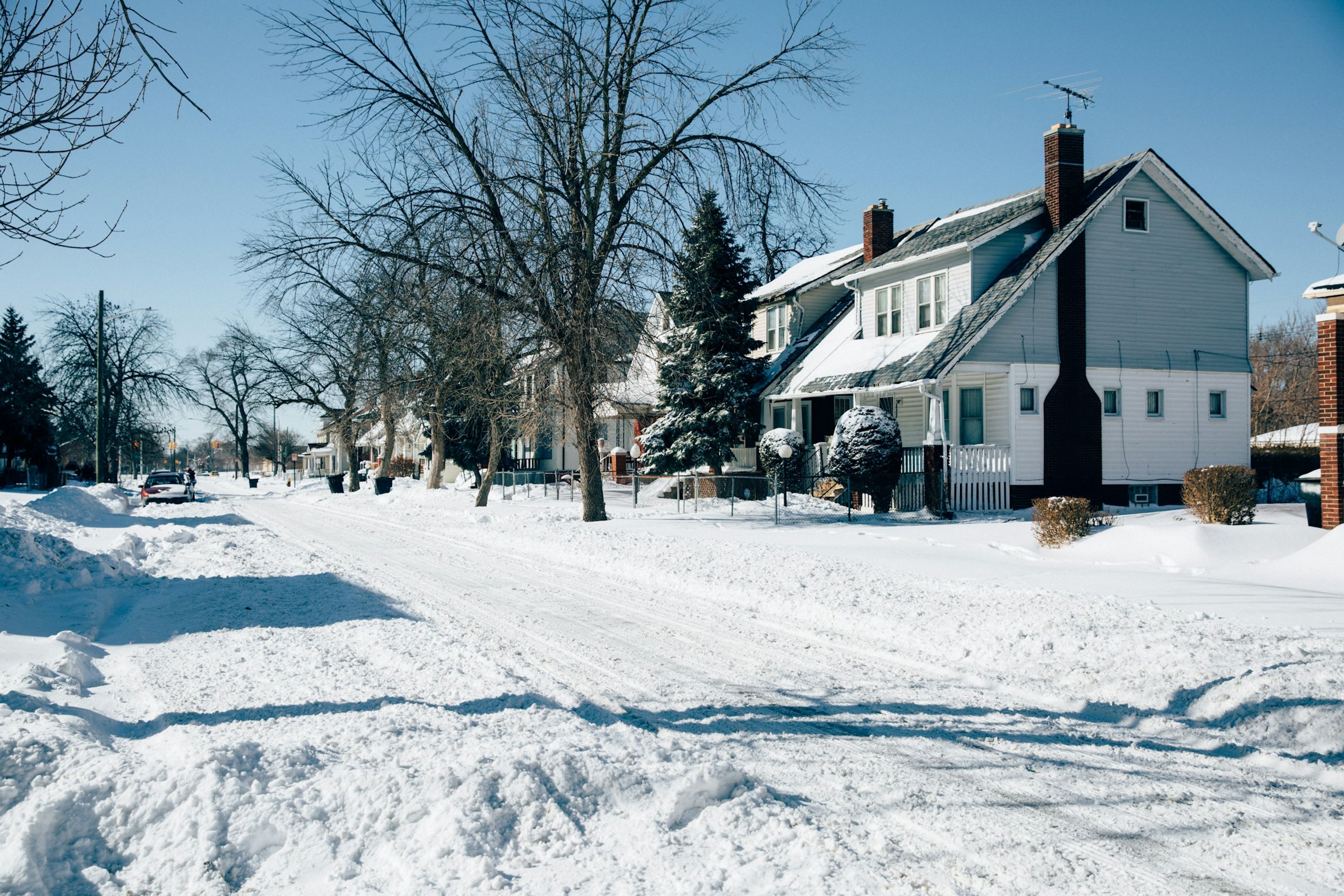 Houses behind a snowed-in street