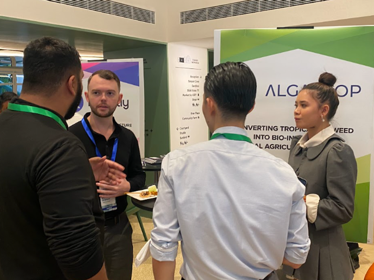 Algatrop founders at their booth at a Startupbootcamp Singapore event