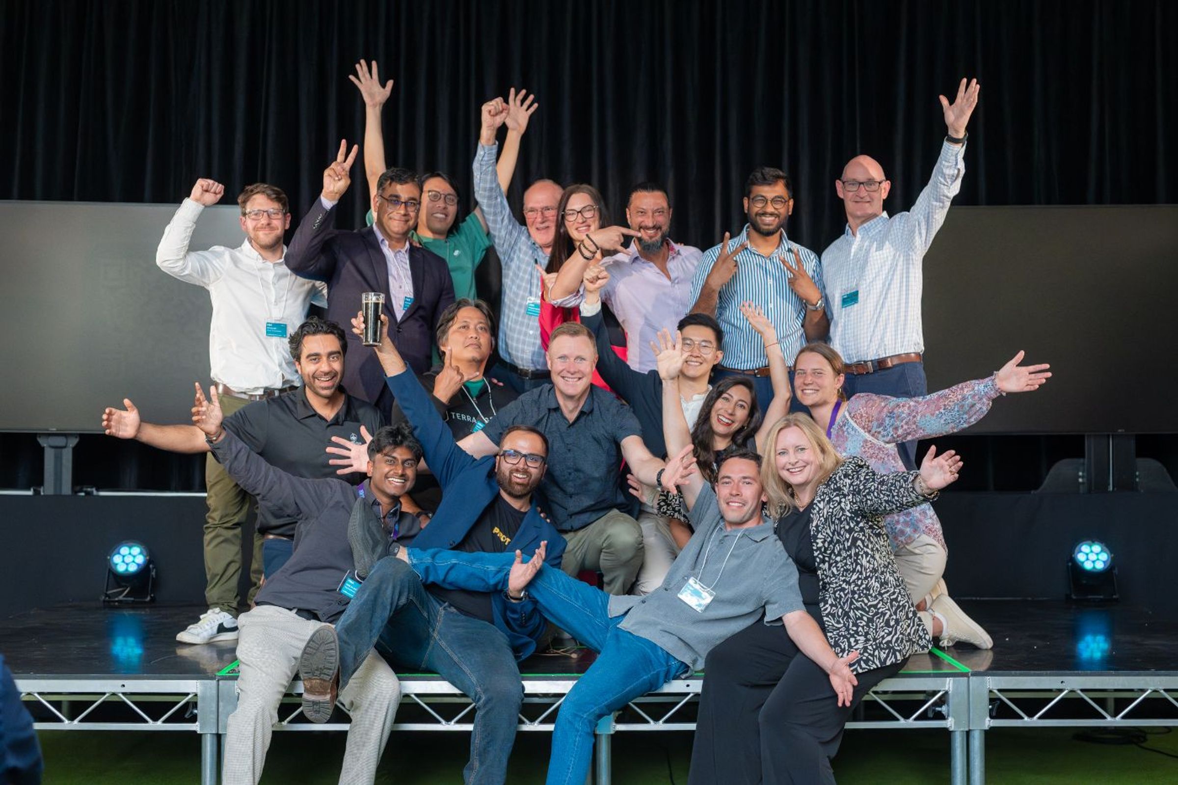 Startupbootcamp FoodTech Tasmania founders, mentors and team celebrating on stage at demo day