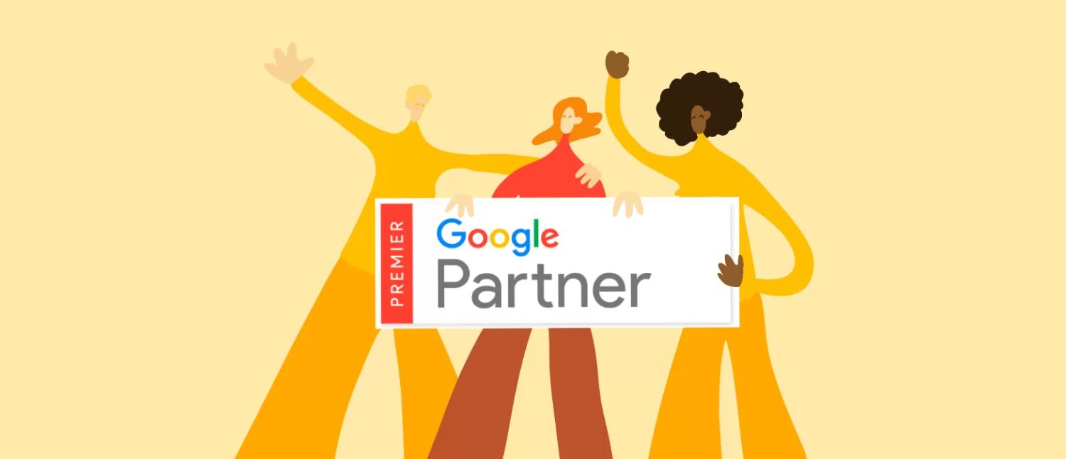 Tre personer og Google Premier Partner skilt