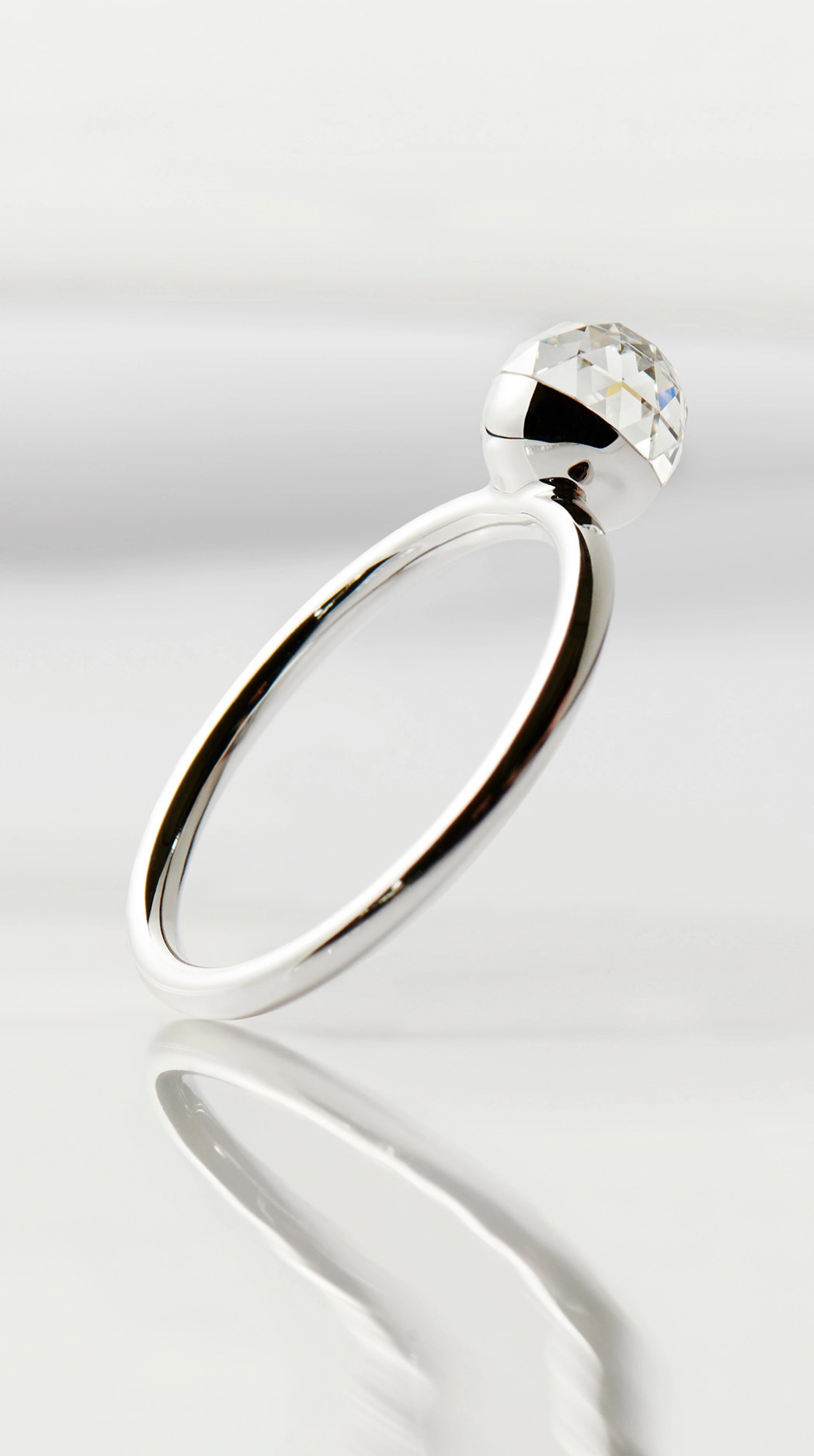 Floating bubble lab-grown diamond ring with multifaceted 360° shine created from renewable energy.