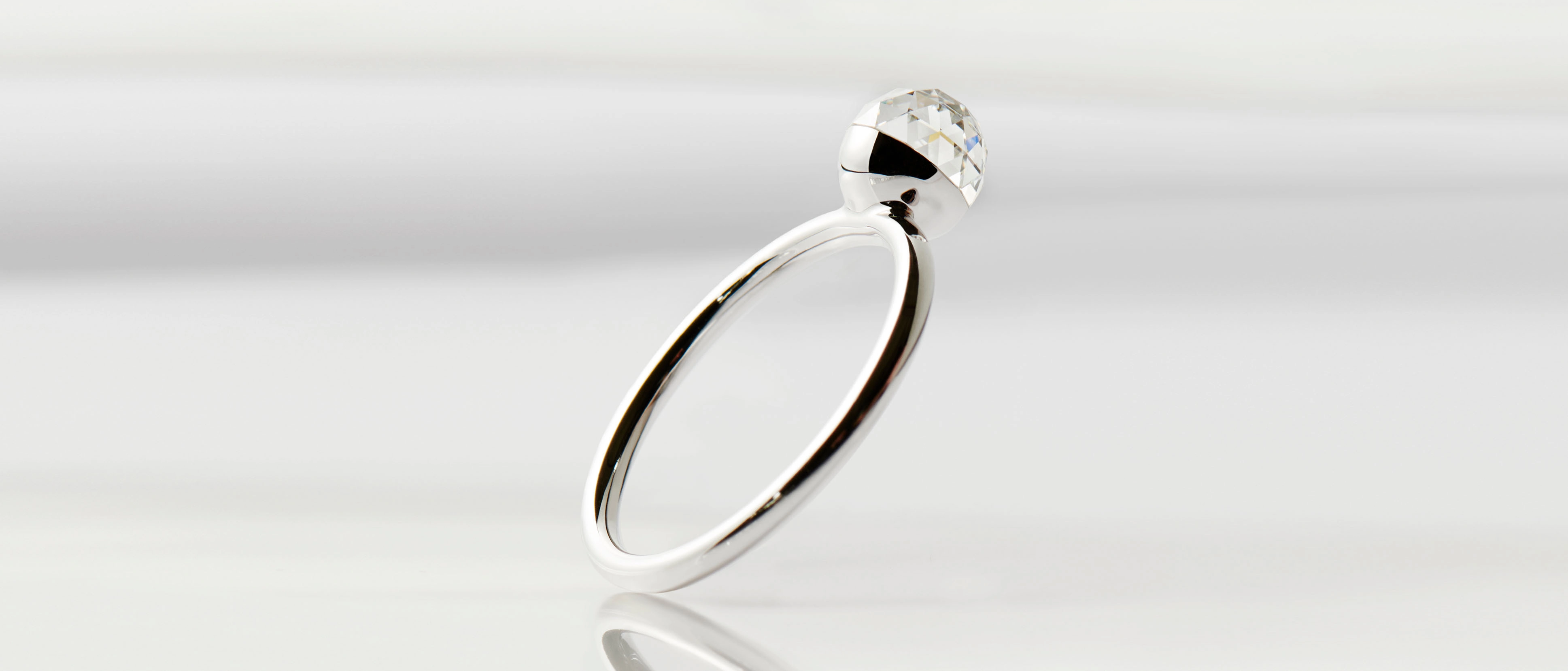 Floating bubble lab-grown diamond ring with multifaceted 360° shine created from renewable energy.