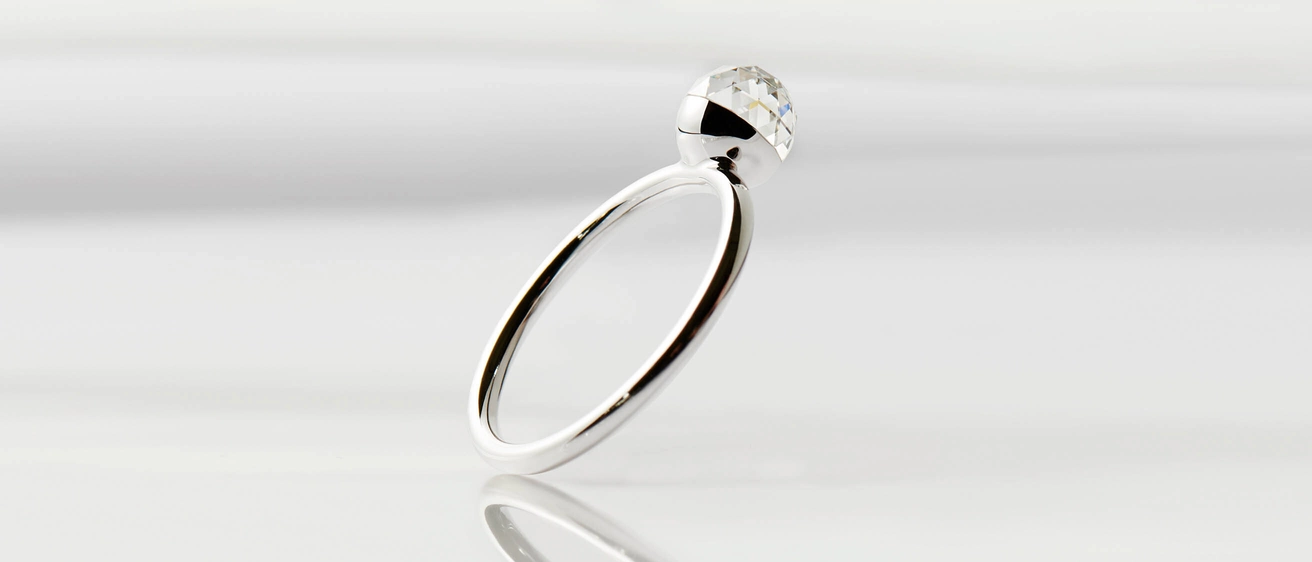 Floating bubble lab-grown diamond ring with multifaceted 360° shine created from renewable energy.