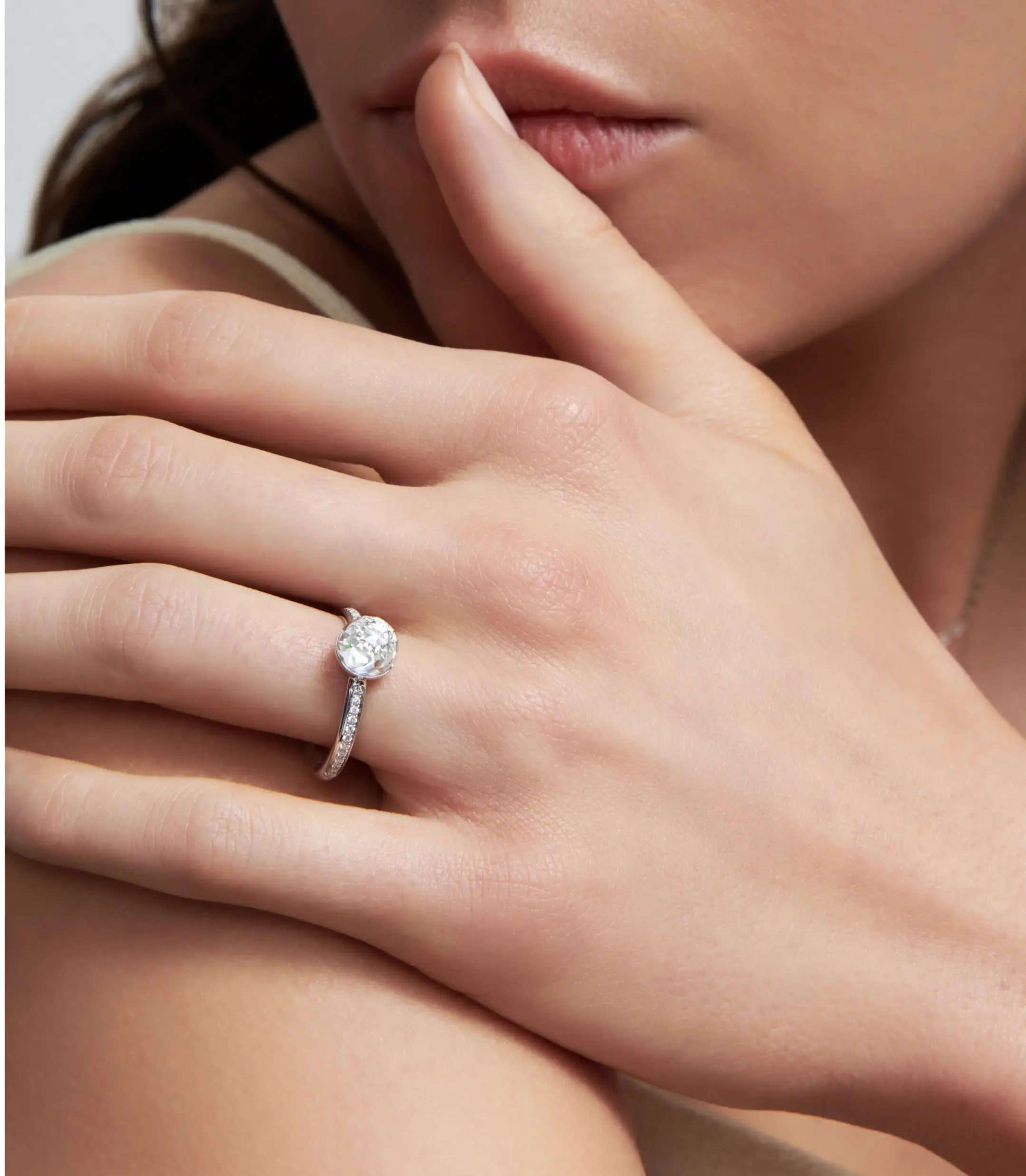 Signature cut bubble lab-gown diamond 18k white gold ring with pave setting.