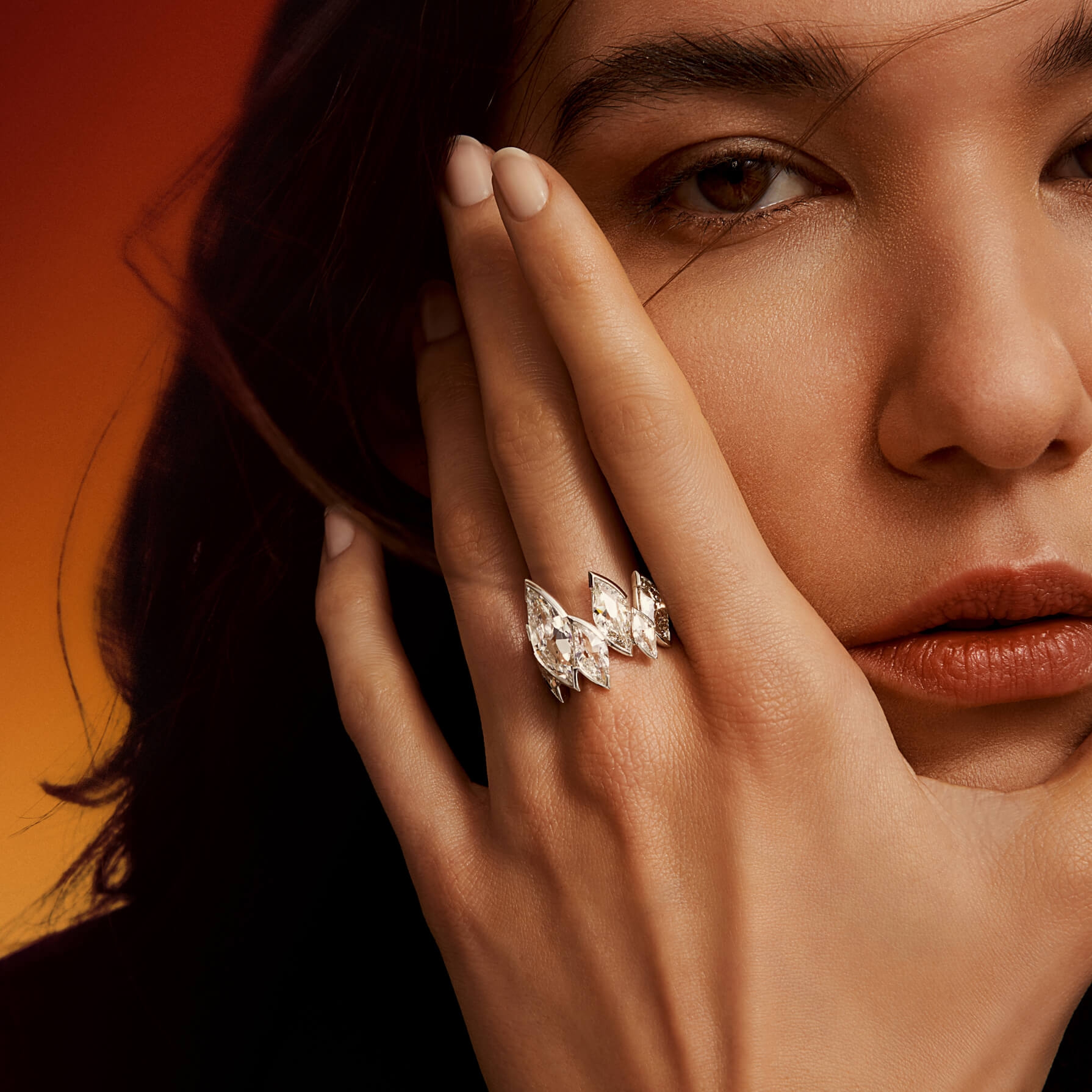 Featuring a signature cut flame diamond statement ring. 