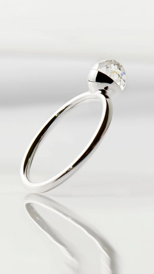 Floating bubble lab-grown diamond ring with multifaceted 360° shine created from renewable energy.