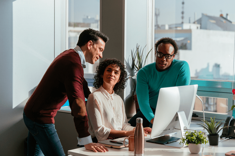 Colleagues meeting at a computer