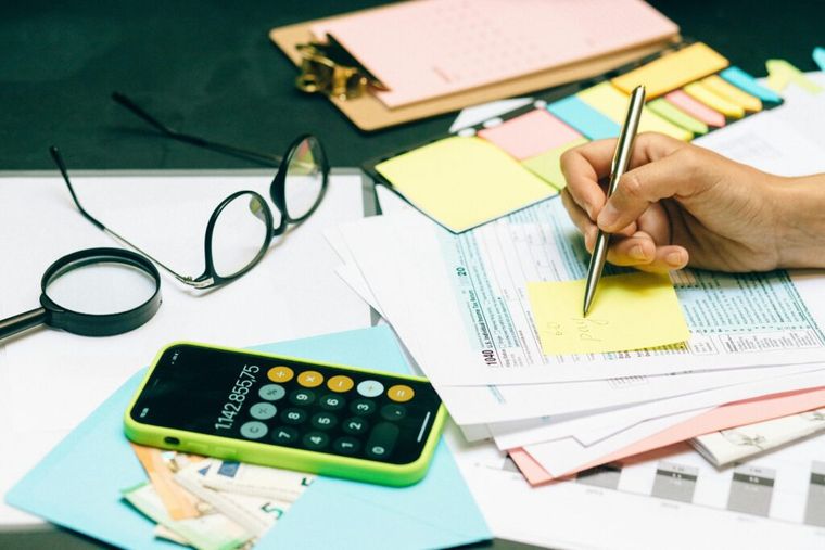 Tax filing paperwork next to a calculator.