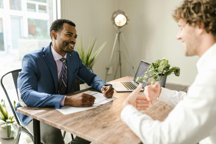 Financial advisors providing personalized crypto tax advice in a modern office setting.