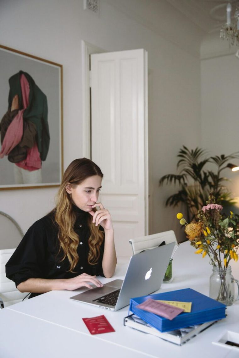 A woman studying data on a computer