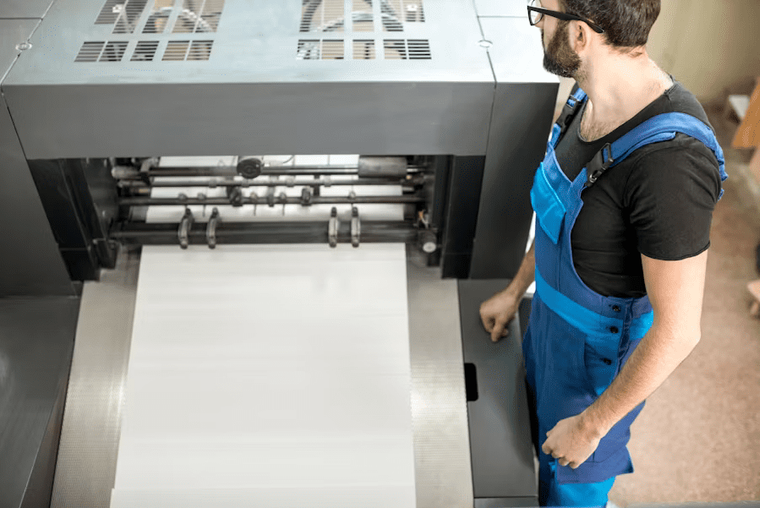 Business professionals installing new equipment in an office, illustrating eligible purchases under Section 179 depreciation.
