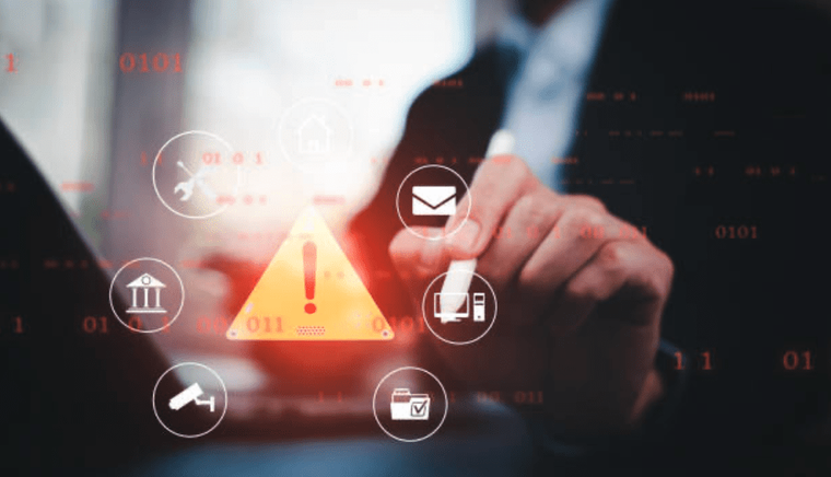 Laptop screen showing an error and caution triangle, symbolizing cybersecurity risks, system errors, and potential hacker attacks.