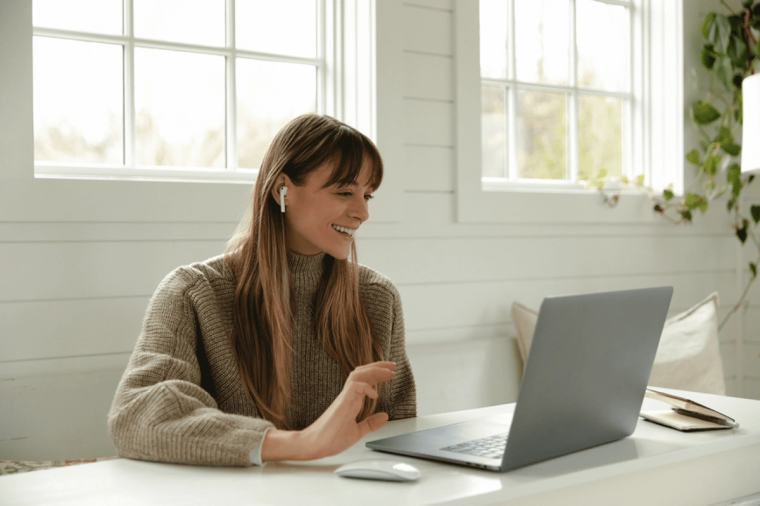 A woman on a video call on a laptop