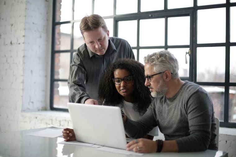 Business team discussing digital asset compliance and the 2025 crypto wash sale rule.