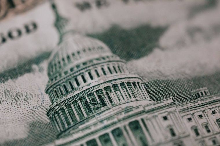 A close up of the US Capitol on a $50 bill