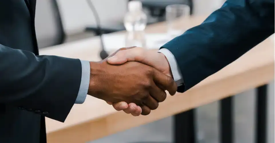 an image of two hands shaking