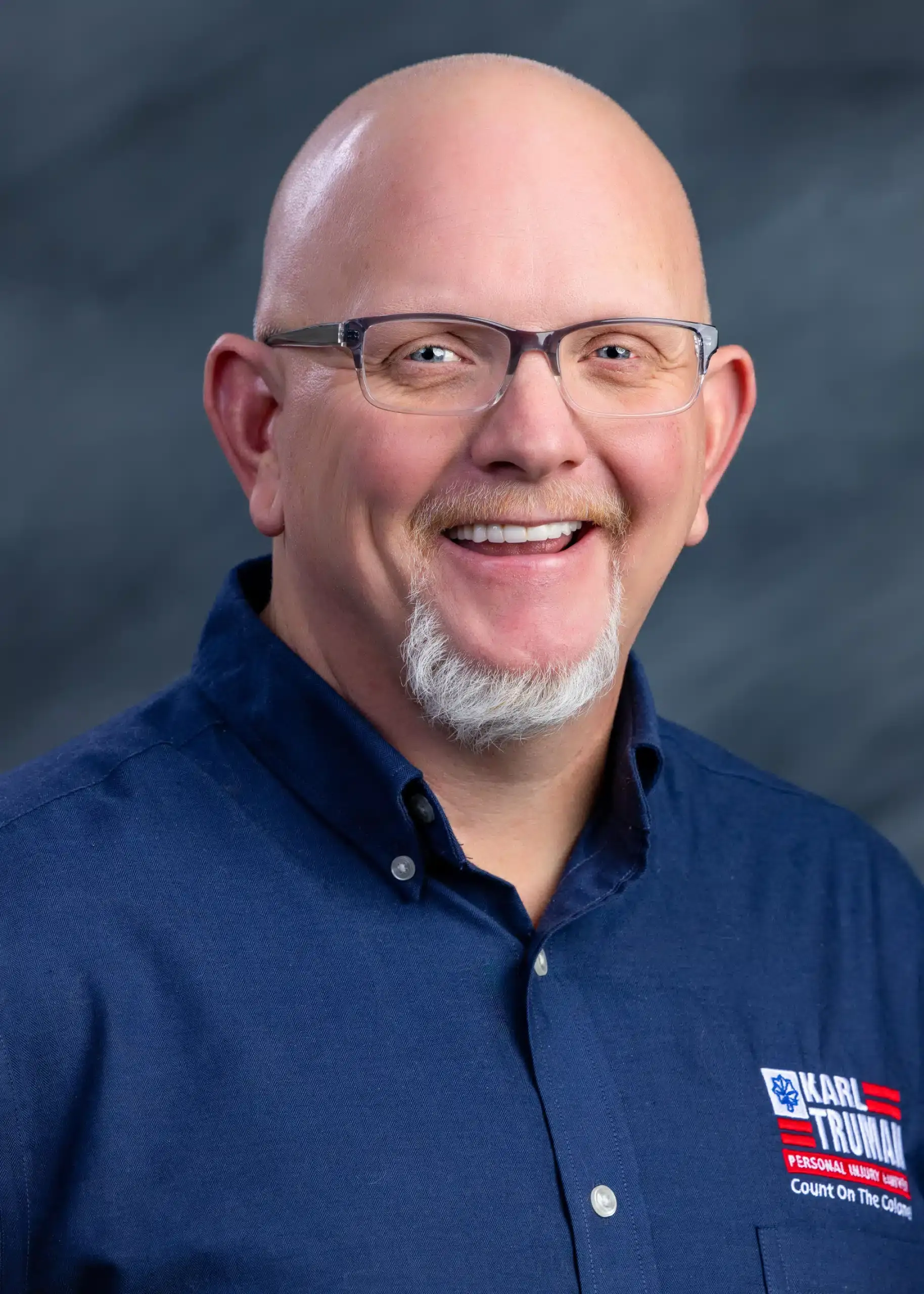 a person wearing glasses and a blue shirt