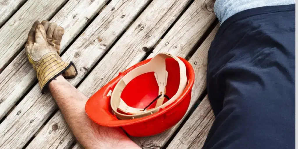 an image of hard hat and a hand with a gloves