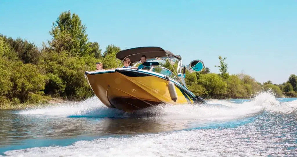 a picture a yellow boat on a river