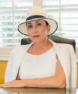 a person in a white suit and hat