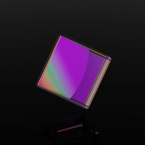 A rotating cube prism refracting a spectrum of light