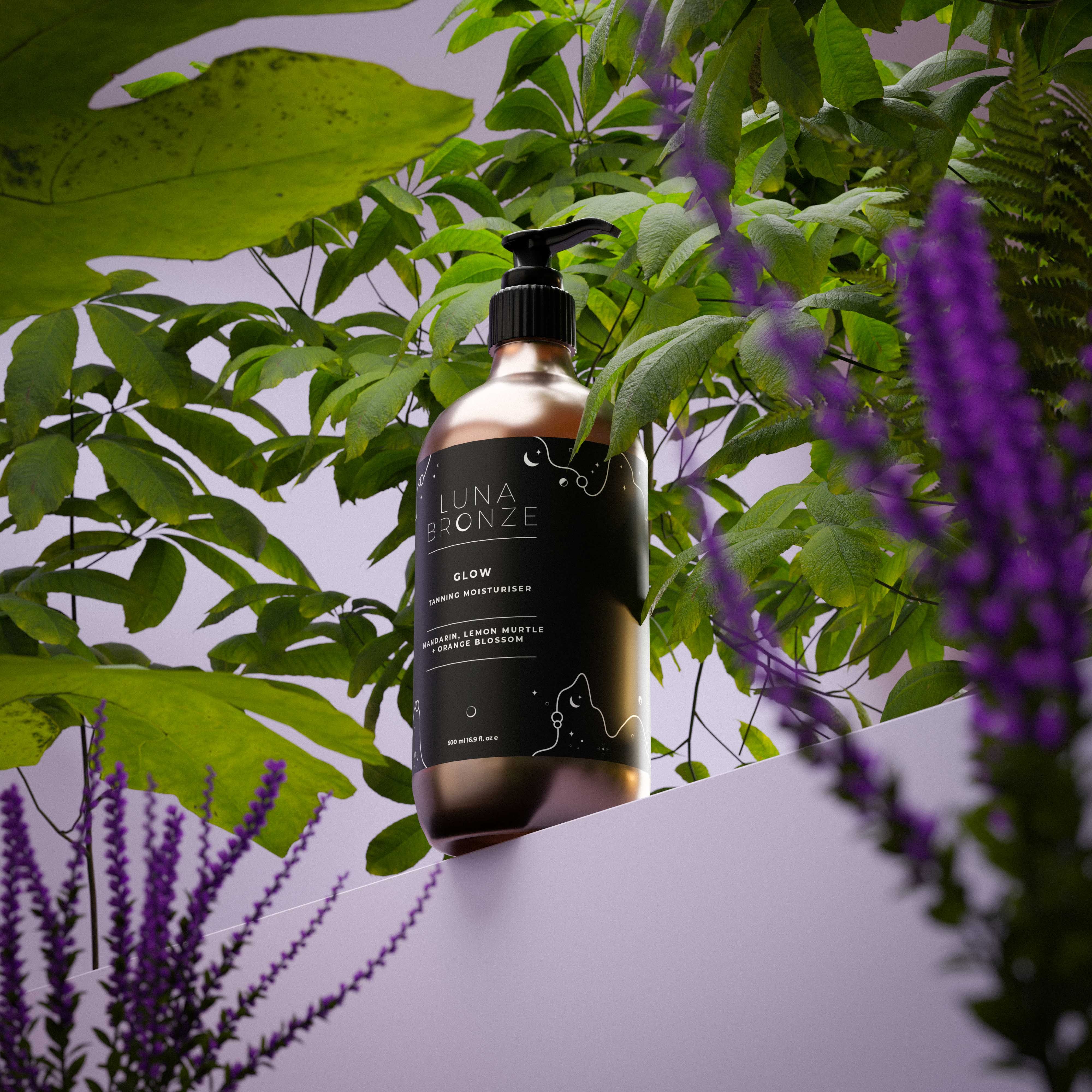 A cosmetic pump bottle surrounded by lush foliage