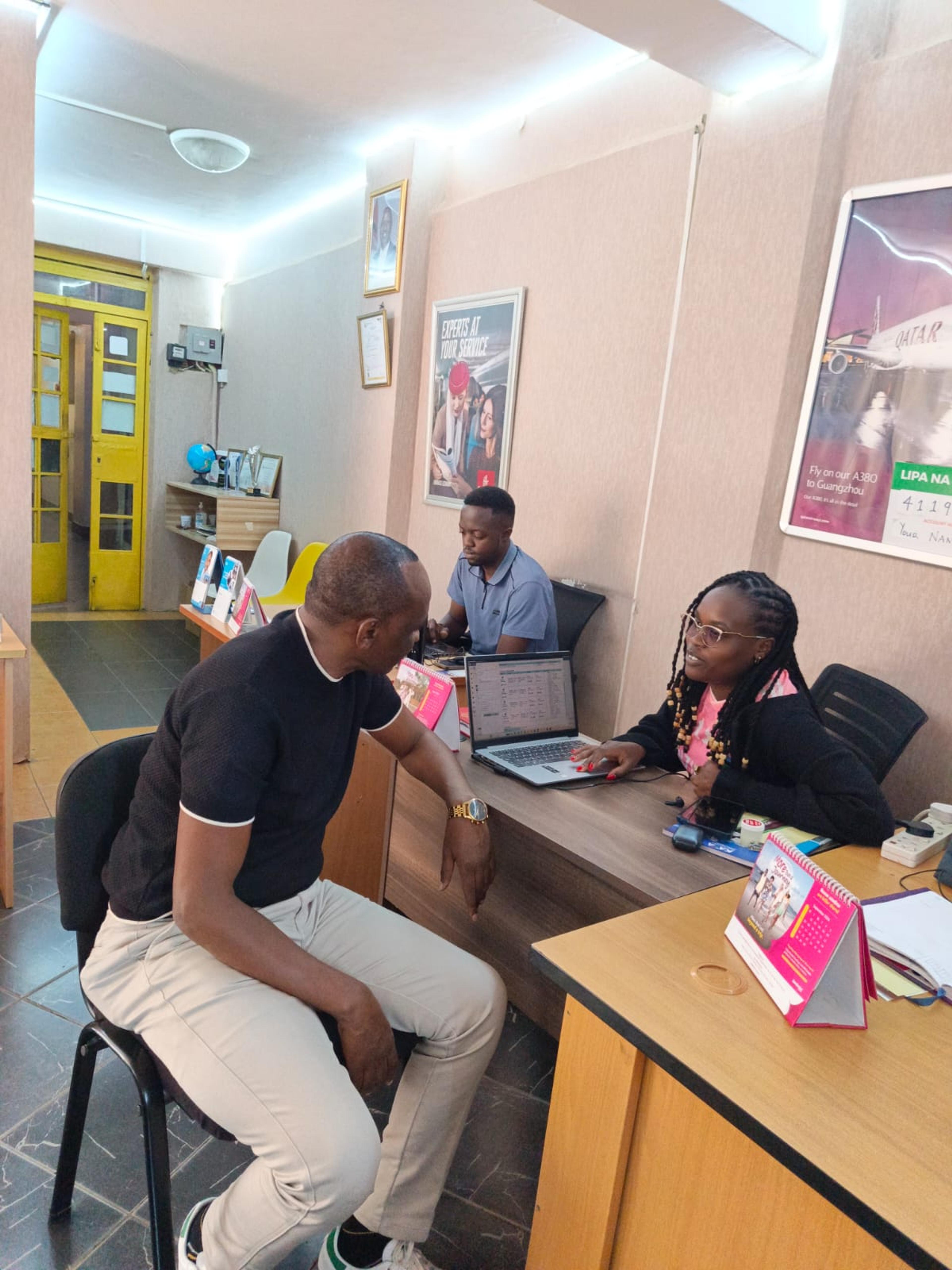 Corporate travel account manager reviewing booking activity, approvals and travel reports with an organisation’s finance team.