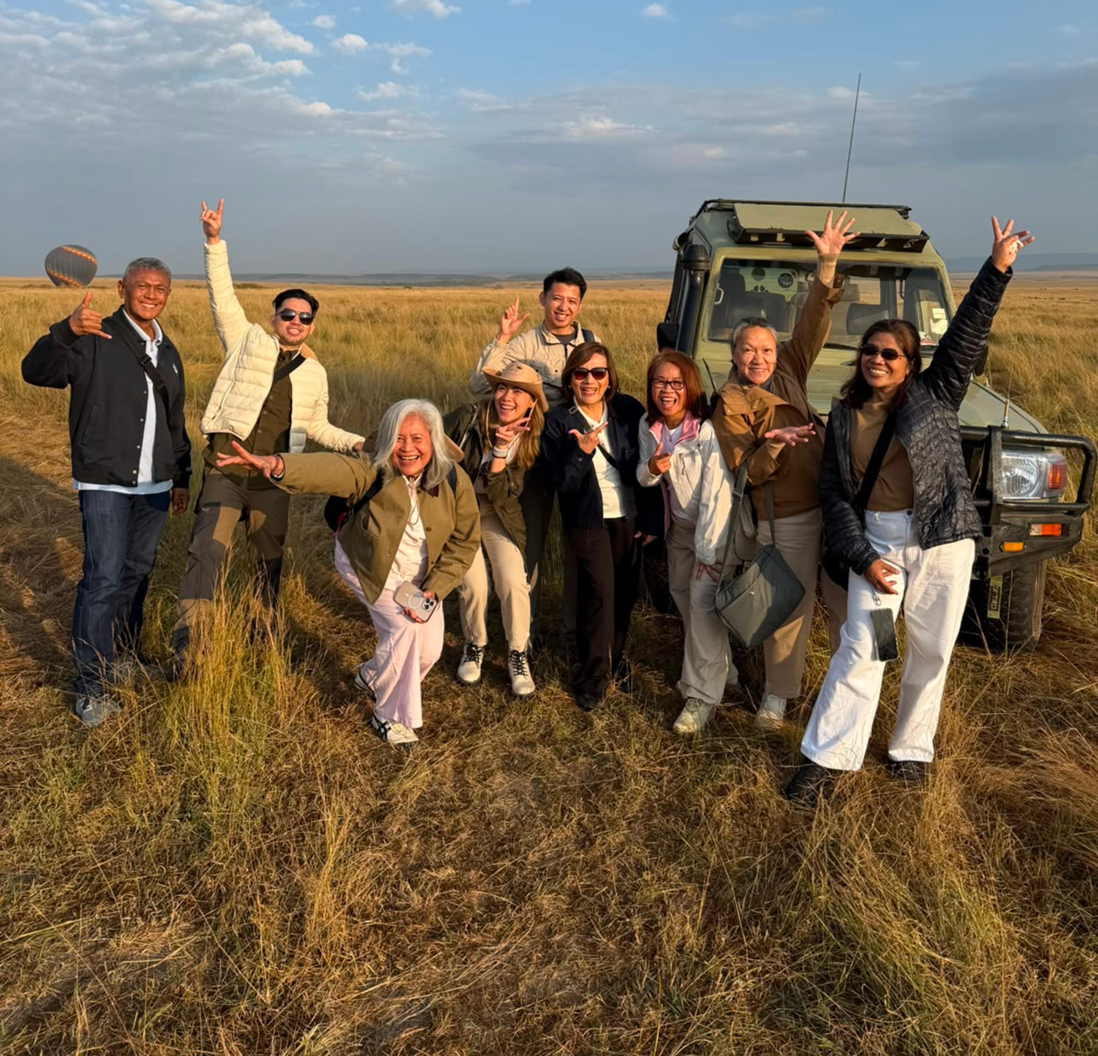 Corporate incentive group enjoying an outdoor bush dinner during a MICE programme in Kenya
