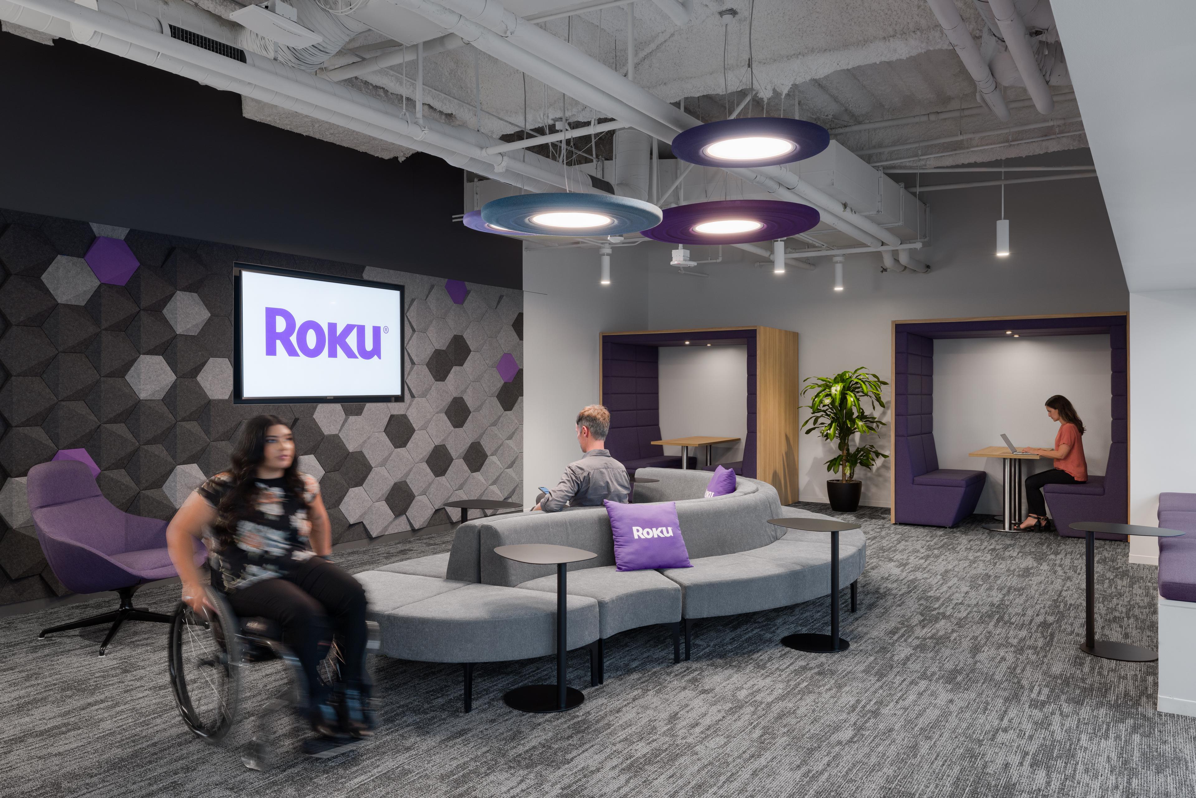 Roku's office with Turf's Hex and Hive acoustic wall tiles in grey and purple Roku branding colors.