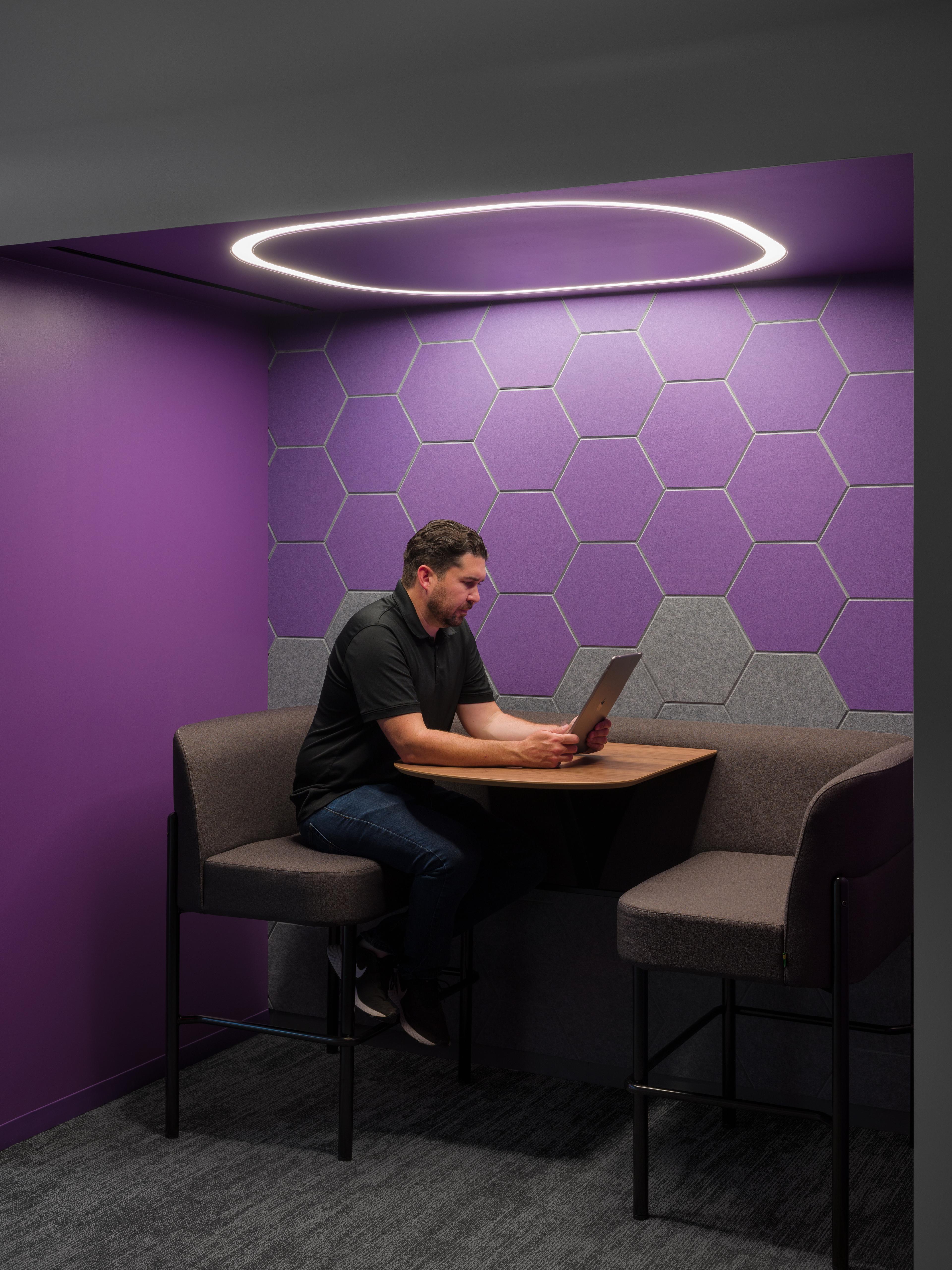 Turf's Hive acoustic wall tile in purple and grey to match Roku's branding in their office.