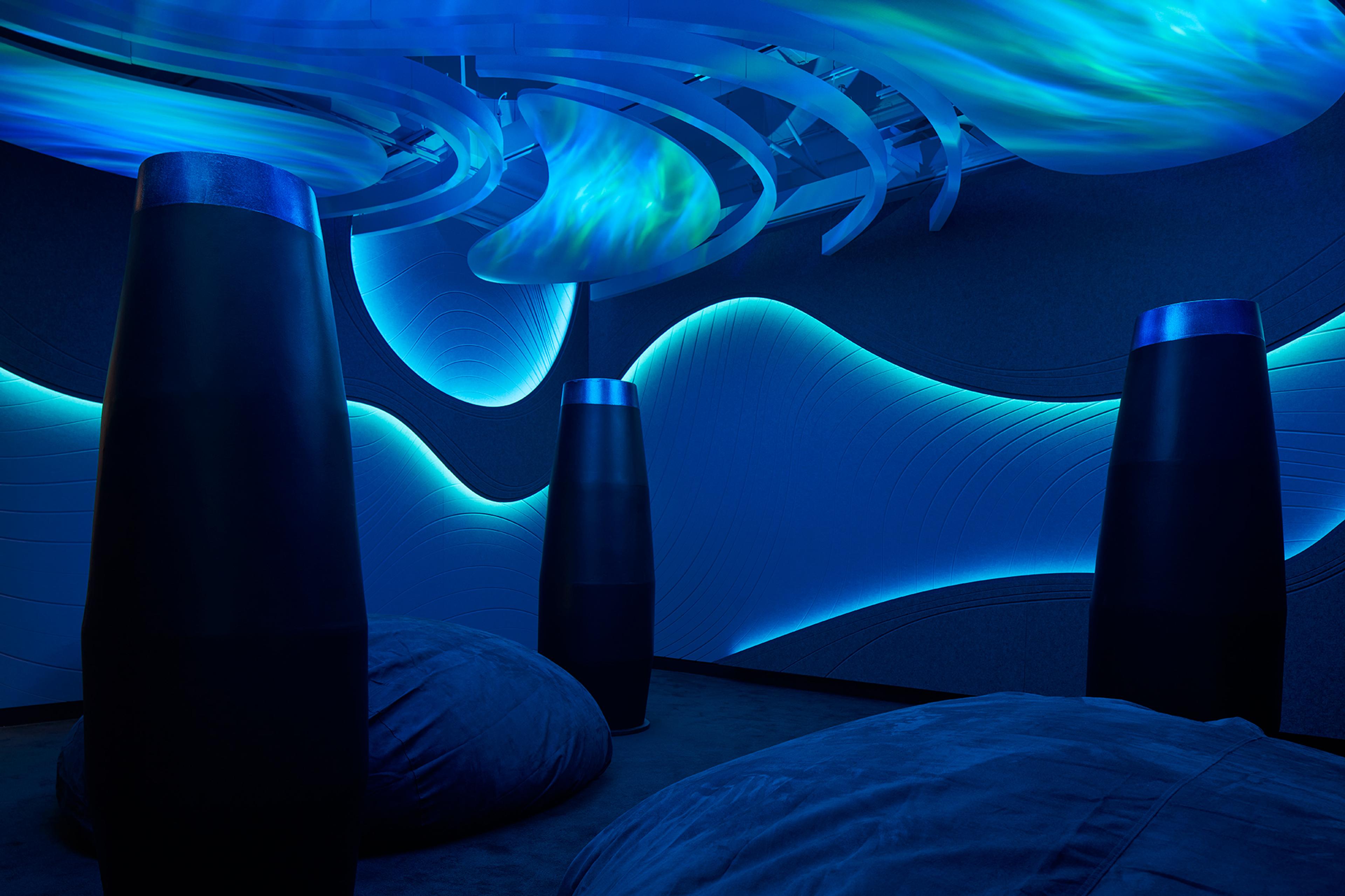 Turf's 2023 NeoCon Showroom with acoustic ceiling installations and mood lighting.