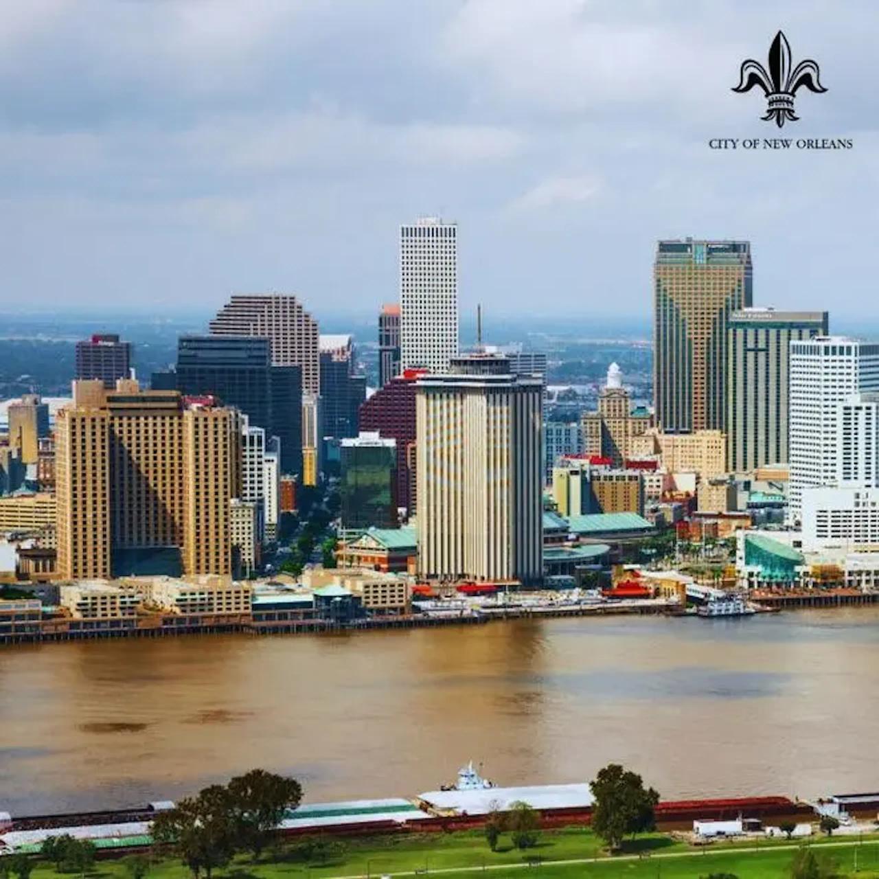 New Orleans city skyline along the Mississippi River with downtown buildings in daylight