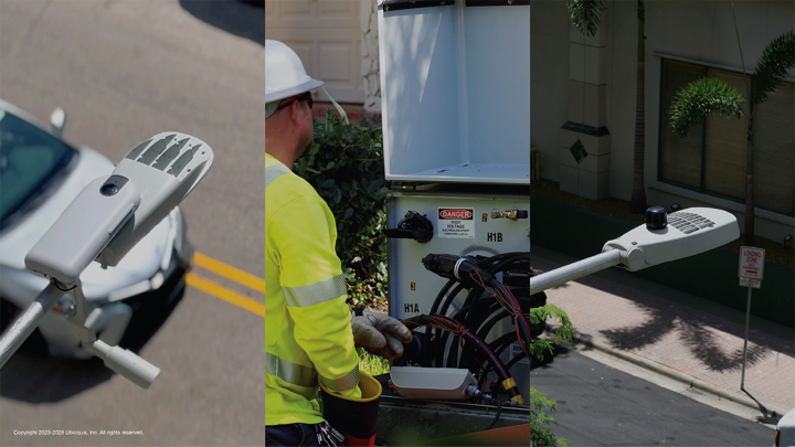 Worker standing near streetlight equipment with mounted UbiHub AI+, UbiGrid DTM+, and UbiCell during outdoor infrastructure maintenance