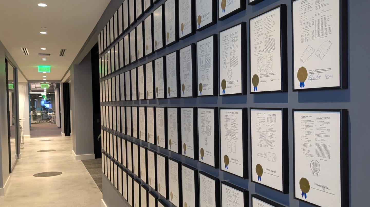 Ubicquia office hallway with many framed patent documents