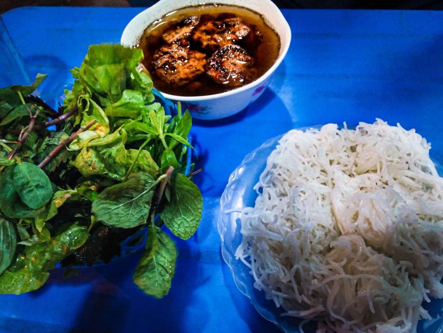 a local dish Bun Cha originated in Hanoi