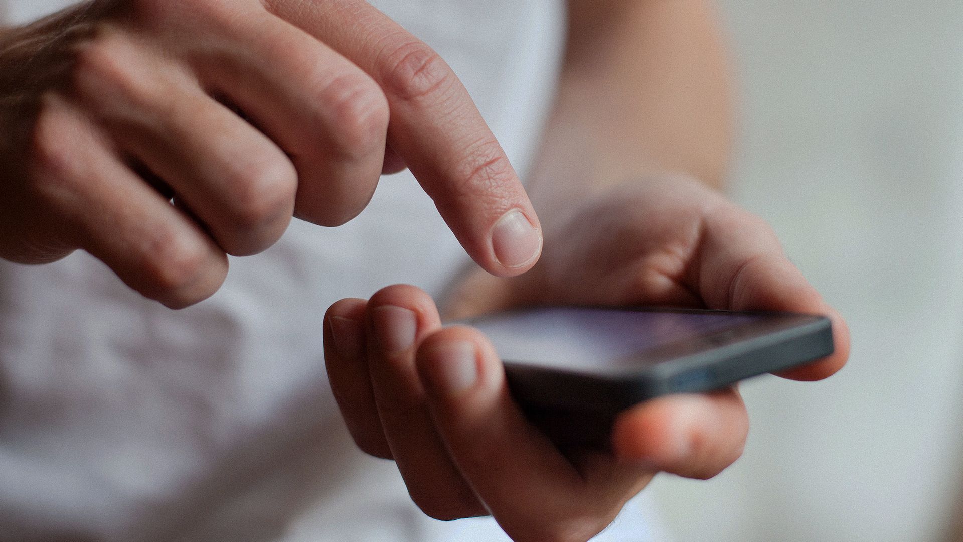 man holding mobile phone