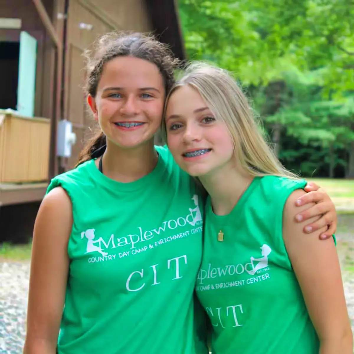 A couple of girls wearing Maplewood CIT t-shirts standing next to each other