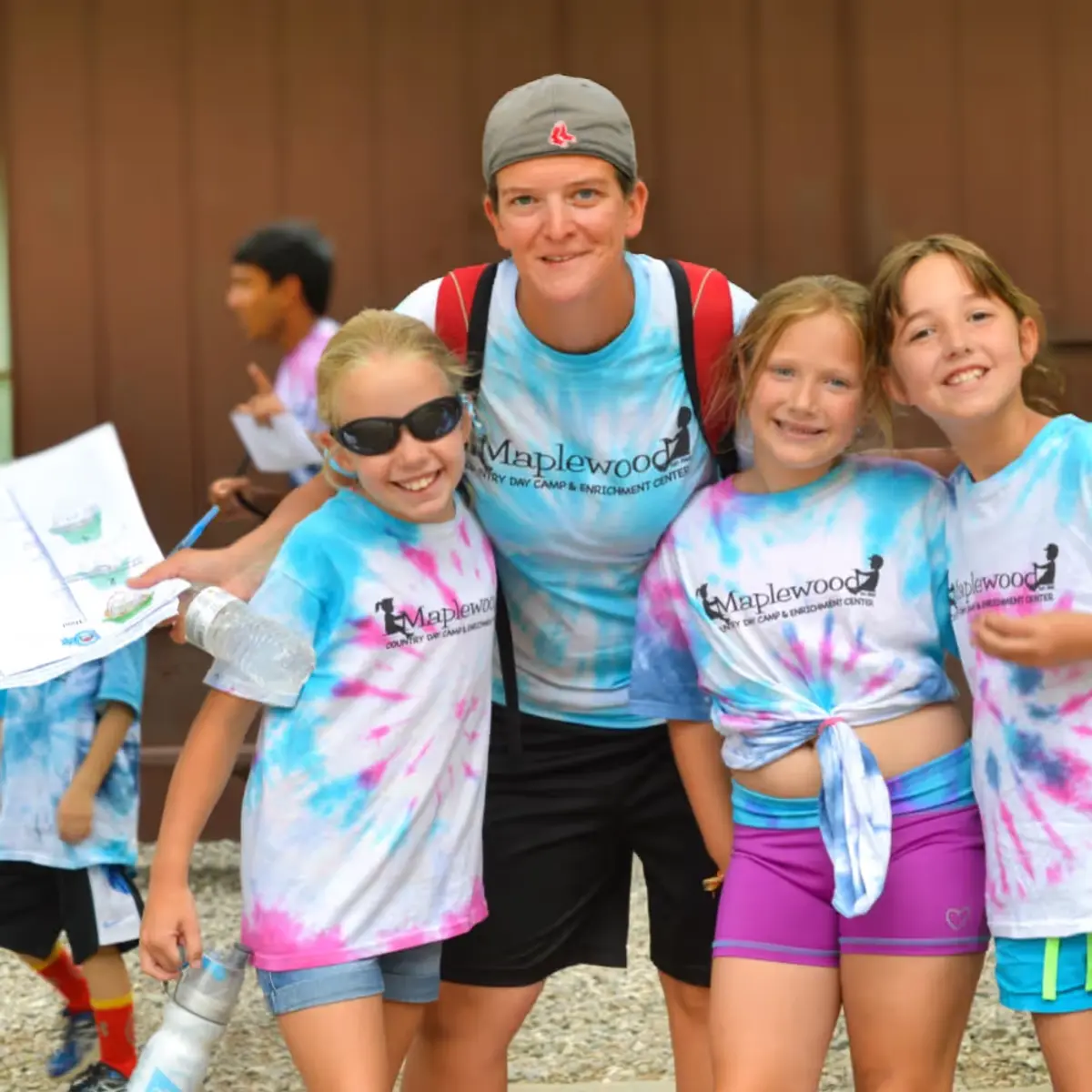A group of young girls standing next to each other